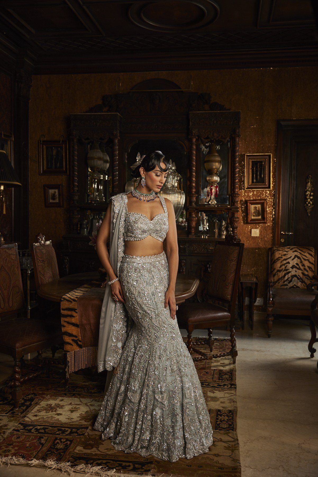Scarlet Rose lookbook — Dusty Blue Lehenga Set, Dusty Blue · Bridal Lehenga: A dusty-blue fishtail lehenga set lit entirely in silver pearl and dabka, with a sculpted blouse and trailing dupatta.