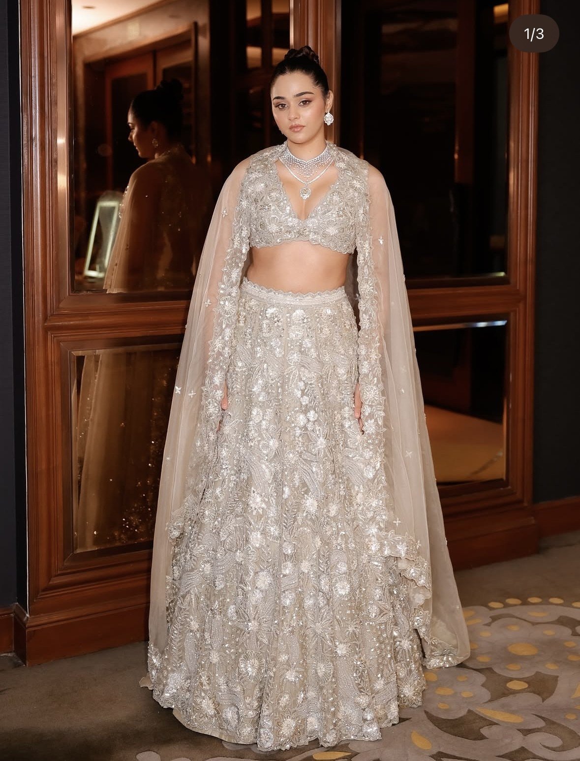 Scarlet Rose lookbook — Dusty Green Lehenga Set, Dusty Green · Bridal Lehenga: Sage-green net under a scatter of sequin rosettes, with a deep-V blouse and a long sheer dupatta.