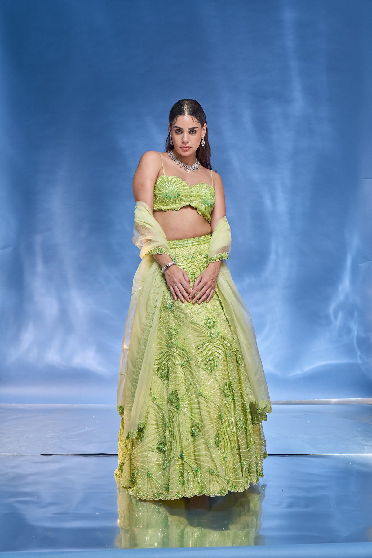 Sea Side Whispers lookbook — Blue-Green Ice-Tones Floral, Marine Blossom: A blue-green sea-star blouse with a hand-embroidered marine lehenga and dupatta set.