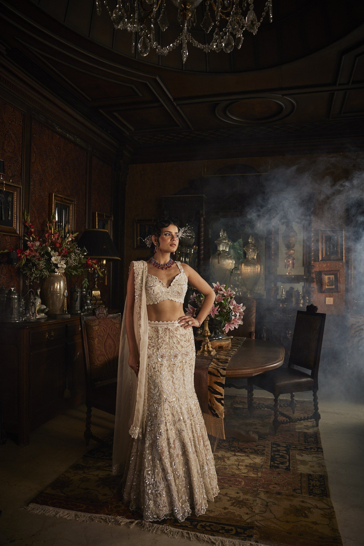 Scarlet Rose lookbook — Ivory Lehenga Set, Ivory · Bridal Lehenga: An ivory lehenga set worked tone-on-tone in pearl and cutdana, with a sculpted sweetheart blouse and a fluid organza dupatta.
